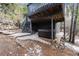 Outdoor hot tub and deck area, perfect for relaxing and enjoying the outdoors at 236 Harris Dr, Idaho Springs, CO 80452
