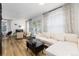 Well-lit living space with white modern furnishings and a stylish dining area at 236 Harris Dr, Idaho Springs, CO 80452