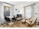 Comfortable living room with modern dining space, bathed in natural light at 236 Harris Dr, Idaho Springs, CO 80452