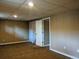 Basement bedroom showcasing a closet, neutral carpet, and versatile layout at 1500 S Perry St, Denver, CO 80219