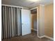 The finished basement bedroom features carpet, a closet, and a doorway at 1500 S Perry St, Denver, CO 80219