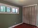 Bedroom featuring two windows for ample natural light, and neutral color walls at 1500 S Perry St, Denver, CO 80219