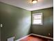 Bedroom featuring hardwood floors, natural light, and neutral wall color at 1500 S Perry St, Denver, CO 80219