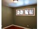 Bedroom featuring two windows for ample natural light, hardwood flooring, and neutral color walls at 1500 S Perry St, Denver, CO 80219