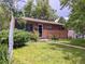 Charming brick home with a well-maintained lawn and inviting front entrance at 1500 S Perry St, Denver, CO 80219