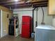 A finished basement includes a compact laundry area and kitchenette with a retro red Galanz refrigerator at 1500 S Perry St, Denver, CO 80219