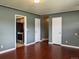 Open-concept living room with hardwood floors, connecting seamlessly to other areas at 1500 S Perry St, Denver, CO 80219