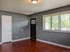 Spacious living room with hardwood floors, offering both storage and access to other rooms at 1500 S Perry St, Denver, CO 80219