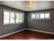 Inviting living room with hardwood floors, featuring two large windows for abundant sunlight at 1500 S Perry St, Denver, CO 80219