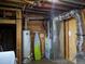 The basement utility room includes a water heater, furnace, ironing board, and washer and dryer hookups at 1500 S Perry St, Denver, CO 80219