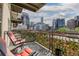Balcony with chairs offering panoramic city views of the Denver skyline at 1975 N Grant St # 509, Denver, CO 80203
