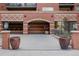 Attractive brick building with well-maintained landscaping and prominent signage at 1975 N Grant St # 509, Denver, CO 80203