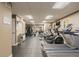 Well-equipped fitness center with treadmills, ellipticals, and weight machines at 1975 N Grant St # 509, Denver, CO 80203