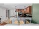 Updated kitchen with modern stainless steel appliances and seating at the bar at 1975 N Grant St # 509, Denver, CO 80203