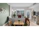 Cozy living room with green accent wall, city views, and lots of natural light at 1975 N Grant St # 509, Denver, CO 80203