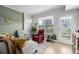 Bright living room featuring a city view from the windows, seating, and stylish decor at 1975 N Grant St # 509, Denver, CO 80203