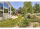 Backyard featuring a play set, a large window wall, and lush landscaping at 12705 Kalamath Ct, Westminster, CO 80234