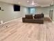 Finished basement area offers a comfortable seating area with a large couch and entertainment center at 12705 Kalamath Ct, Westminster, CO 80234
