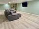 Finished basement area offers a comfortable seating area with a large couch and entertainment center at 12705 Kalamath Ct, Westminster, CO 80234