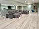 Finished basement area offers a comfortable seating area with a large couch and entertainment center at 12705 Kalamath Ct, Westminster, CO 80234