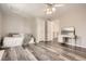 Charming bedroom featuring hardwood floors, and a built-in bed under a bright ceiling fan at 12705 Kalamath Ct, Westminster, CO 80234