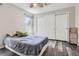 Bedroom with queen bed, hardwood floors, and double door closet at 12705 Kalamath Ct, Westminster, CO 80234