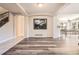 Open concept living area with neutral paint, hardwood floors and a spacious layout at 12705 Kalamath Ct, Westminster, CO 80234