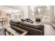 Open living room boasts high ceilings, a fireplace, and large windows with plenty of natural light at 12705 Kalamath Ct, Westminster, CO 80234