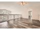 An open loft area with luxury vinyl plank flooring, a ceiling fan, and a vaulted ceiling at 12705 Kalamath Ct, Westminster, CO 80234