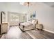 Primary bedroom boasts vaulted ceilings, wood-look floors, lots of natural light and -and- dressers at 12705 Kalamath Ct, Westminster, CO 80234