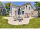 Beautiful backyard with an outdoor seating area, mature trees, and a swing at 12705 Kalamath Ct, Westminster, CO 80234