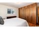 Comfortable bedroom featuring hardwood floors and ample closet space at 5067 S Mabre Ct, Littleton, CO 80123
