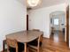 Cozy dining area with hardwood floors, and views into the kitchen and entry way at 5067 S Mabre Ct, Littleton, CO 80123