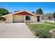 Charming single-story home featuring a well-maintained front yard, attached garage, and neutral exterior paint at 5067 S Mabre Ct, Littleton, CO 80123