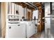 Laundry room features a newer washer and dryer with exposed ductwork above at 5067 S Mabre Ct, Littleton, CO 80123
