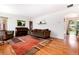 Bright living room features hardwood floors, neutral walls, and plenty of natural light at 5067 S Mabre Ct, Littleton, CO 80123