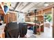 Attached workshop space features a large workbench, pegboard, and access to the backyard at 5067 S Mabre Ct, Littleton, CO 80123