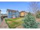 A spacious backyard featuring a lawn, patio, and mature trees, perfect for outdoor enjoyment at 17216 E Trailmaster Dr, Parker, CO 80134