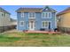 A spacious backyard with a patio and lawn, showcasing the home's exterior and outdoor space at 17216 E Trailmaster Dr, Parker, CO 80134