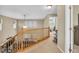 Upstairs hallway area featuring a wood banister and access to multiple rooms at 17216 E Trailmaster Dr, Parker, CO 80134