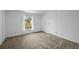 Well-lit bedroom features carpet floors, a window, and a double door closet at 5325 Allison St, Arvada, CO 80002