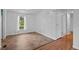 A bright bedroom featuring tiled flooring and a window offering outdoor views at 5325 Allison St, Arvada, CO 80002
