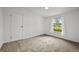 Cozy carpeted bedroom with a large window and ample natural light at 5325 Allison St, Arvada, CO 80002