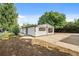 Exterior side view showcasing the yard, patio, and house at 5325 Allison St, Arvada, CO 80002