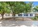 Charming single-story home with a well-maintained lawn and mature trees at 5325 Allison St, Arvada, CO 80002