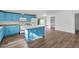 Updated kitchen featuring a center island, modern appliances, and ample storage at 5325 Allison St, Arvada, CO 80002