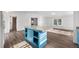 Modern kitchen featuring blue cabinets, white countertops, and new flooring at 5325 Allison St, Arvada, CO 80002