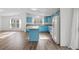 Open kitchen design with an island, lots of cabinets and natural light at 5325 Allison St, Arvada, CO 80002