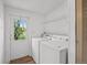 Laundry room featuring new washer and dryer and an exterior door at 5325 Allison St, Arvada, CO 80002