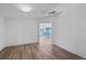 Bright living room featuring wood-look flooring and an open floor plan at 5325 Allison St, Arvada, CO 80002